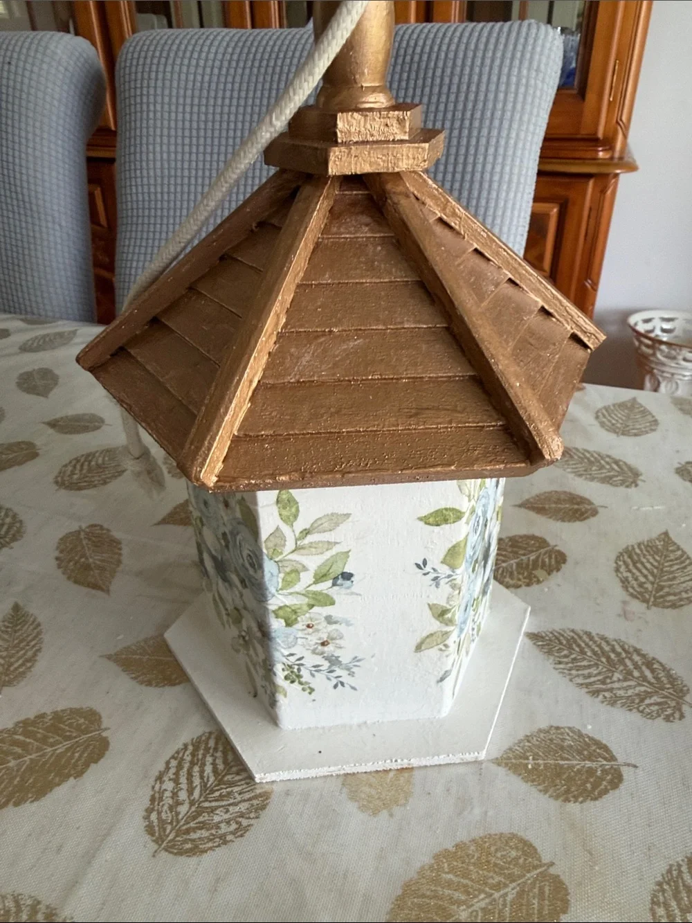 White Birdhouse with Gold Roof and Blue Floral Accents wooden